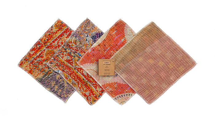 Set of 4 coasters 18x18 cm in patchwork pattern with red, orange, purple and beige colors and visible embroidered edges